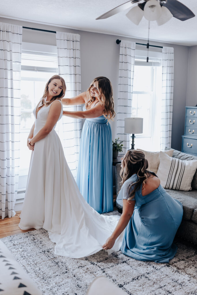 Nashville elopement photographer captures bride getting wedding dress on before wedding