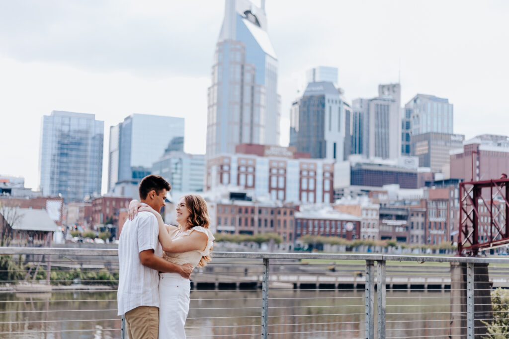 Nashville elopement photographer captures couple kissing in front of the Nashville skyline