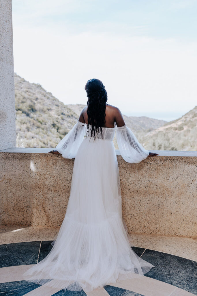 Destination elopement photographer captures bride overlooking view of Catalina Island