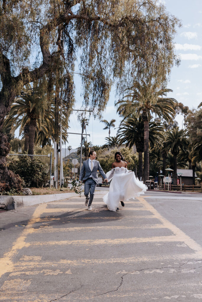 Destination elopement photographer captures couple walking on crosswalk after Catalina Island elopement