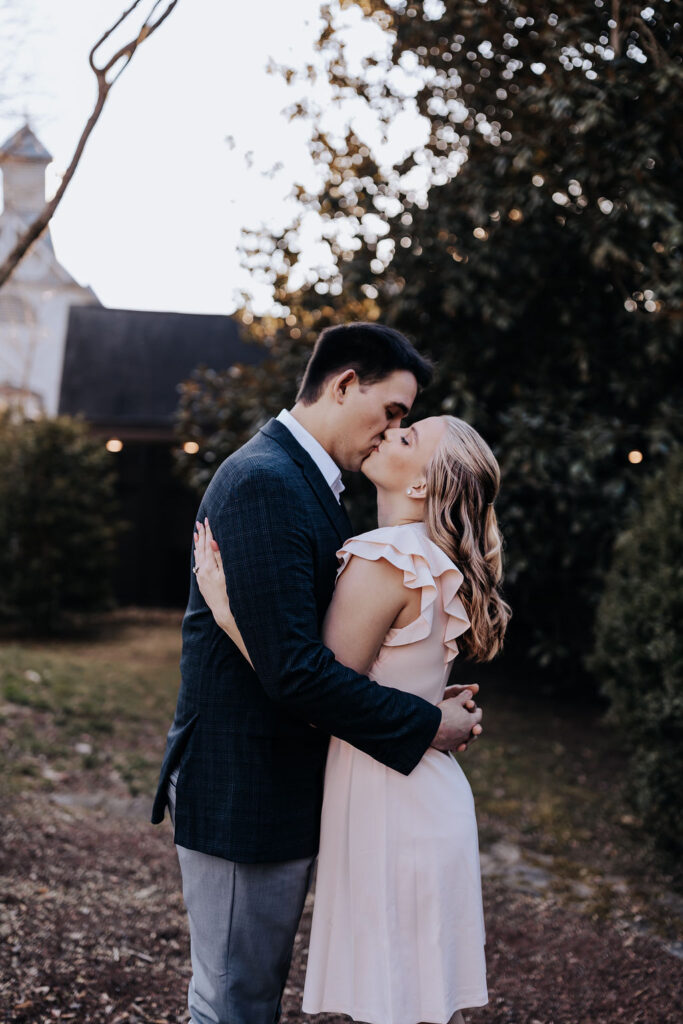 Nashville elopement photographer captures couple kissing during charming tennessee winery engagement