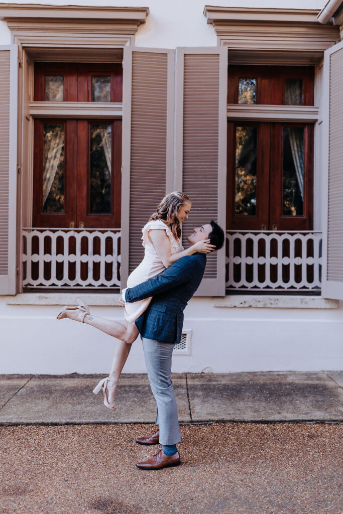 Nashville elopement photographer captures man lifting woman in air kissing her