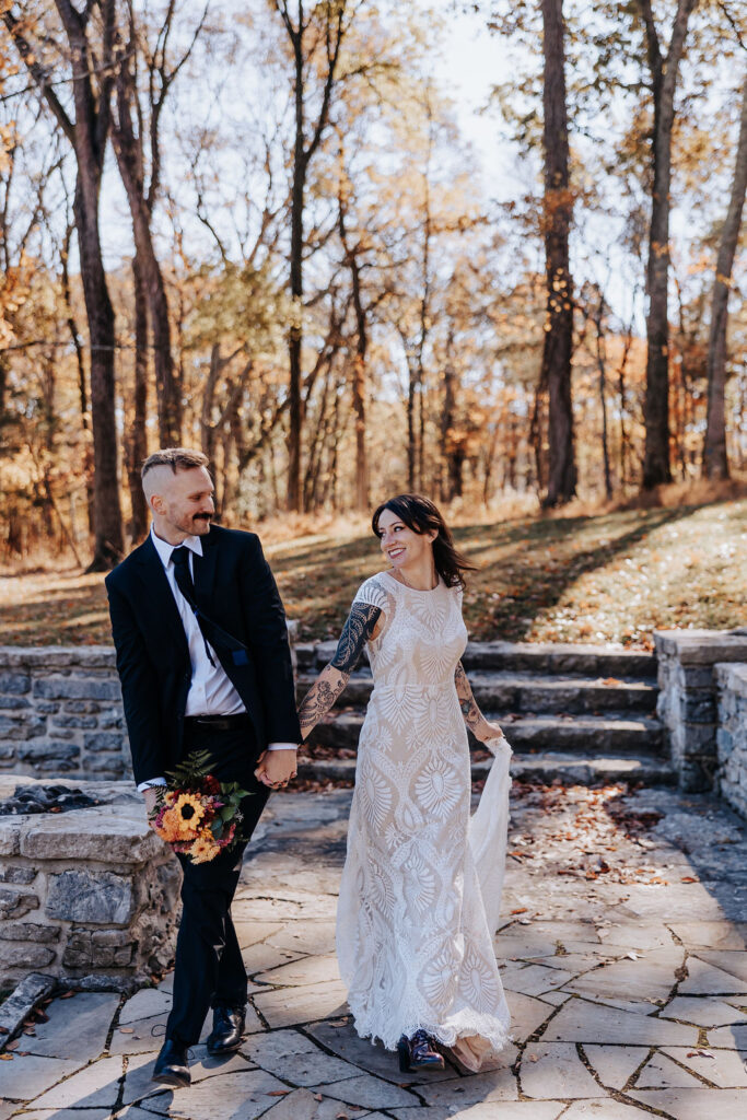 Nashville elopement photographer captures couple holding hands and walking together after Nashville elopement