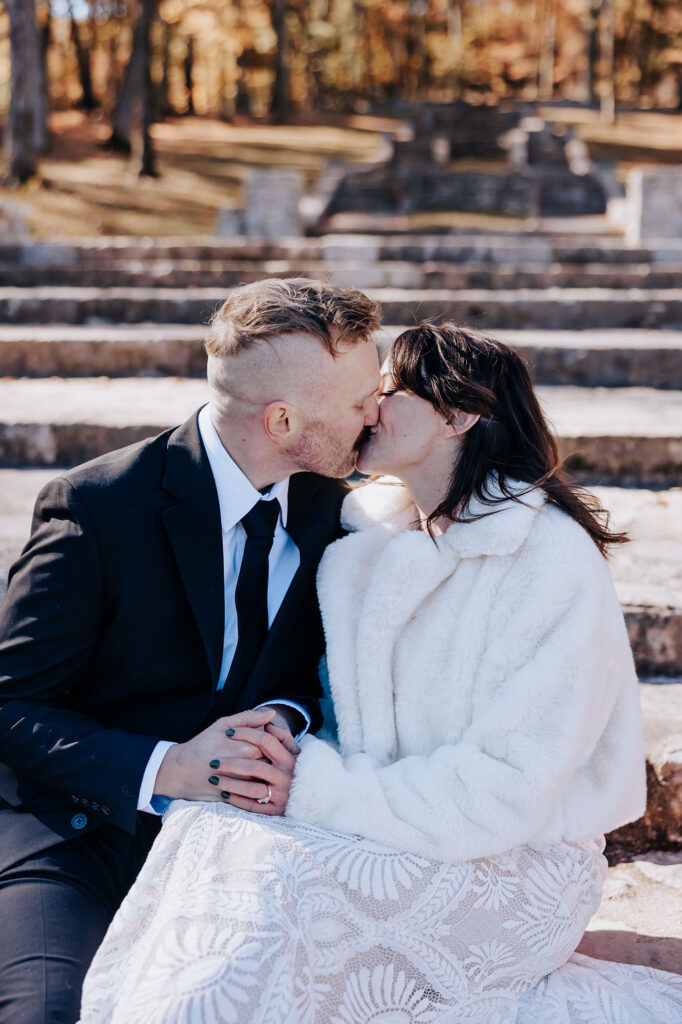 Nashville elopement photographer captures couple kissing on steps