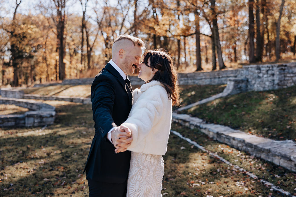 Nashville elopement photographer captures couple holding hands and kissing after Nashville elopement