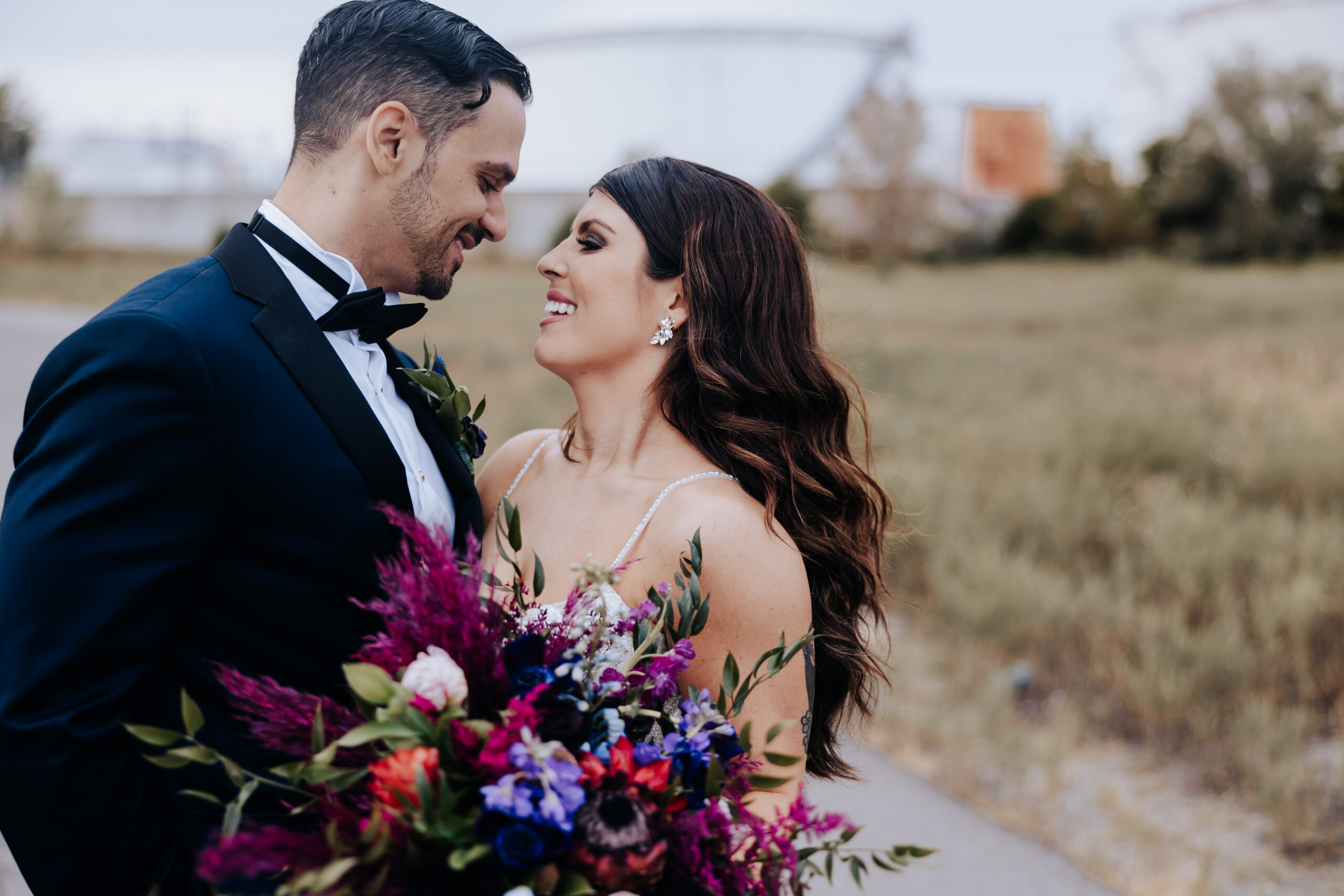 Nashville elopement photographer captures bride and groom smiling at one another after fall wedding