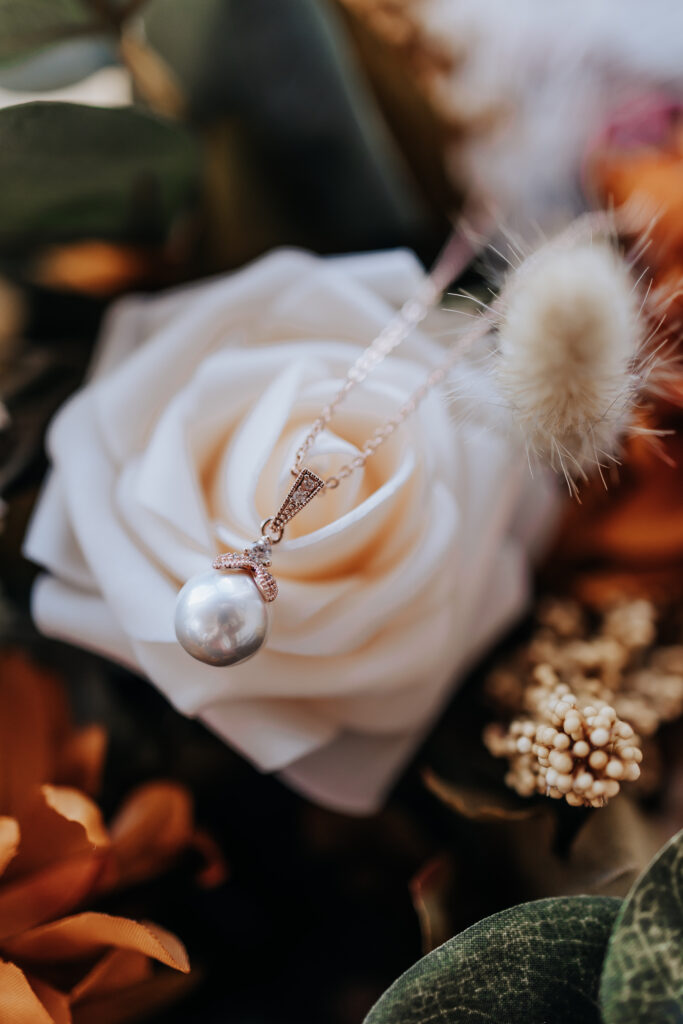 Nashville elopement photographer captures necklace on rose
