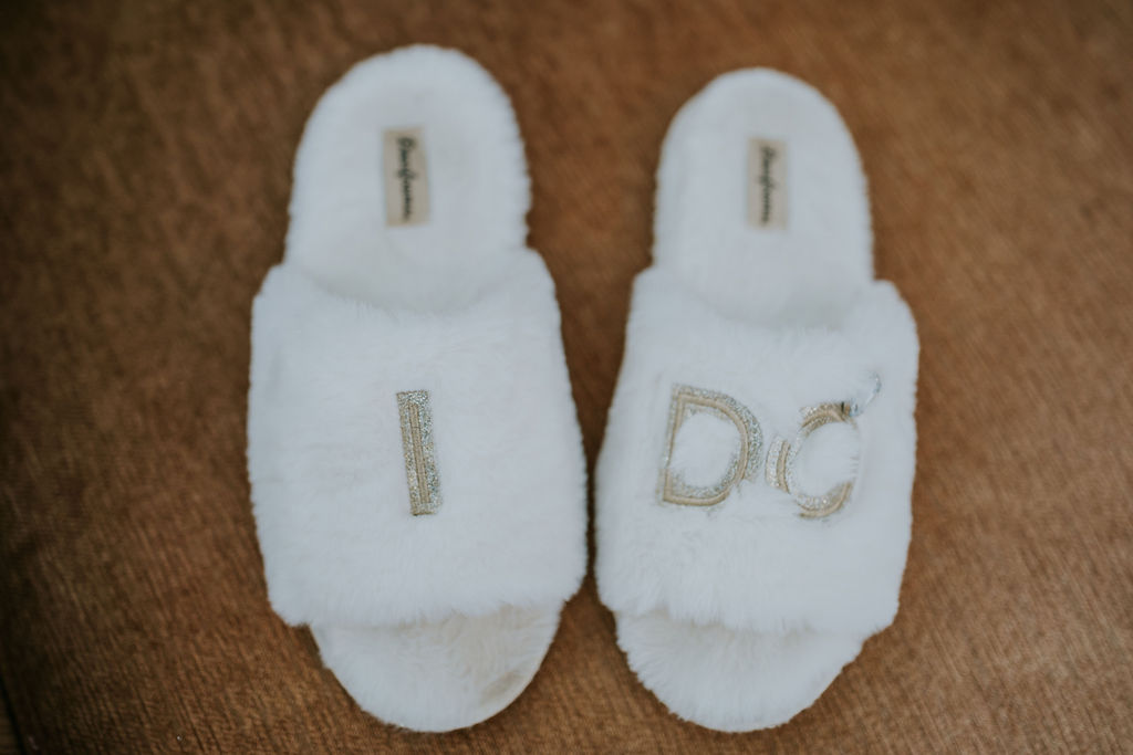Destination wedding photographer captures bride's slippers with 'I do" on them