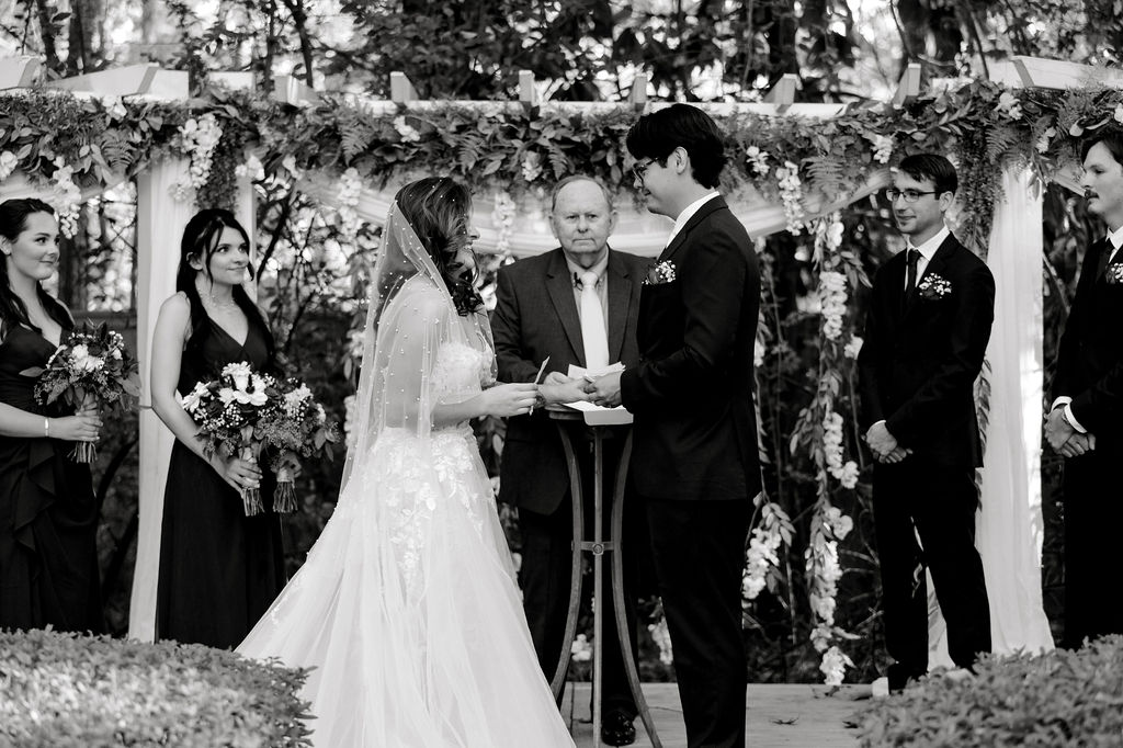 Destination wedding photographer captures black and white portrait of couple during wedding ceremony