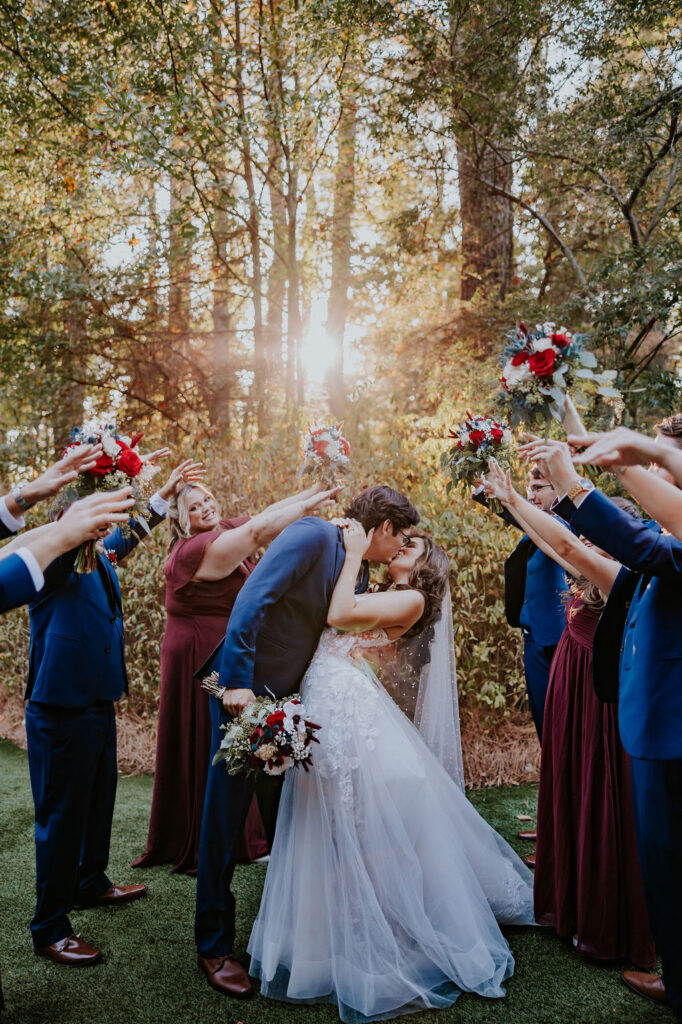 Destination wedding photographer captures bride and groom kissing to celebrate wedding