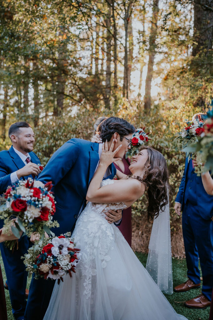 Destination Wedding Photographer captures bride and groom kissing during bridal portraits