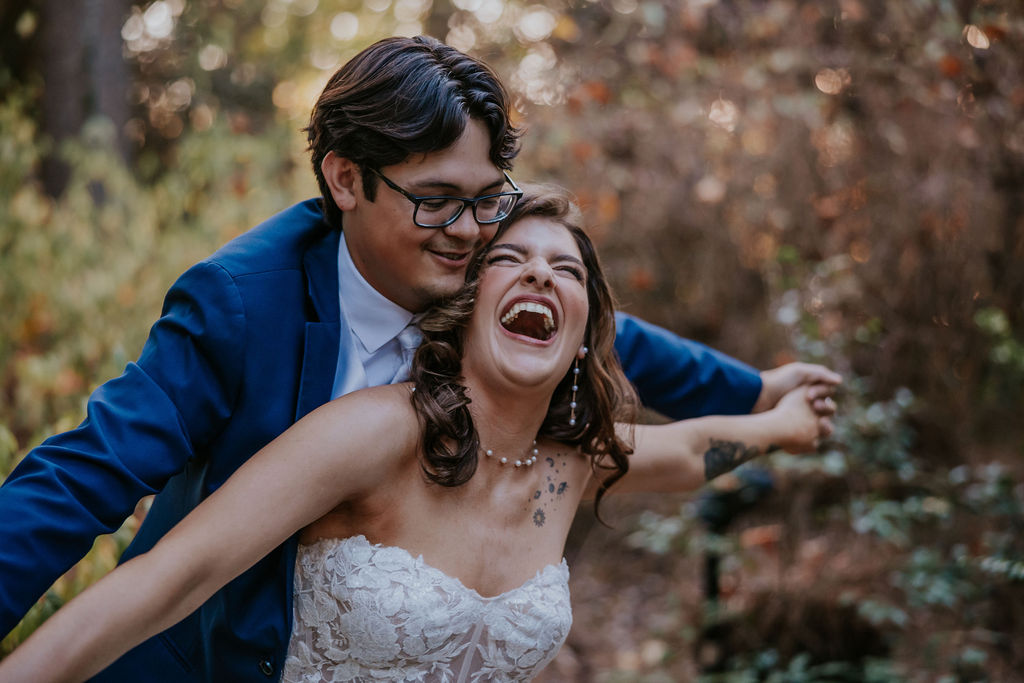 Destination wedding photographer captures bride and groom swaying together and laughing