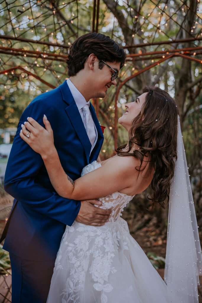 Destination wedding photographer captures bride and groom hugging