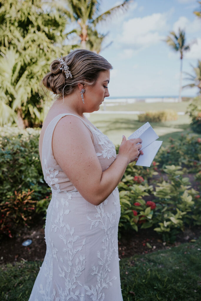 Destination wedding photographer captures bride reading letter from groom