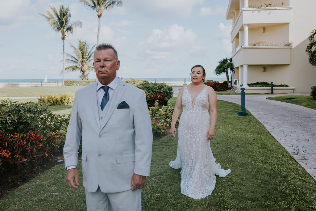 Destination wedding photographer captures bride's first look with father before wedding ceremony