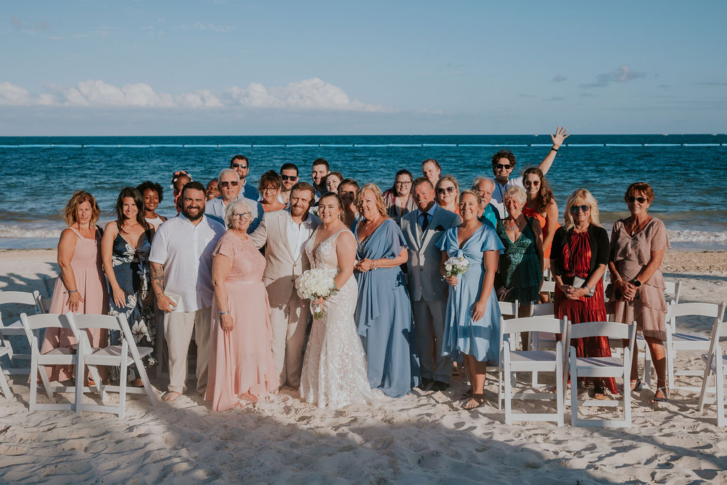 Destination wedding photographer captures newly married couple celebrating with wedding guests