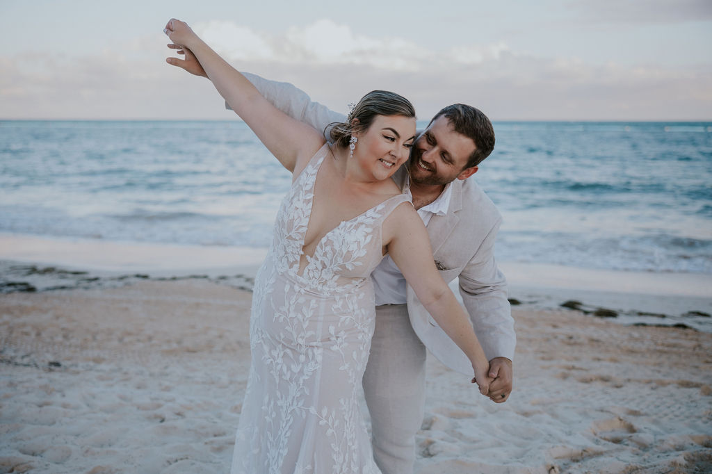 Destination wedding photographer captures bride and groom playing together during bridal portraits