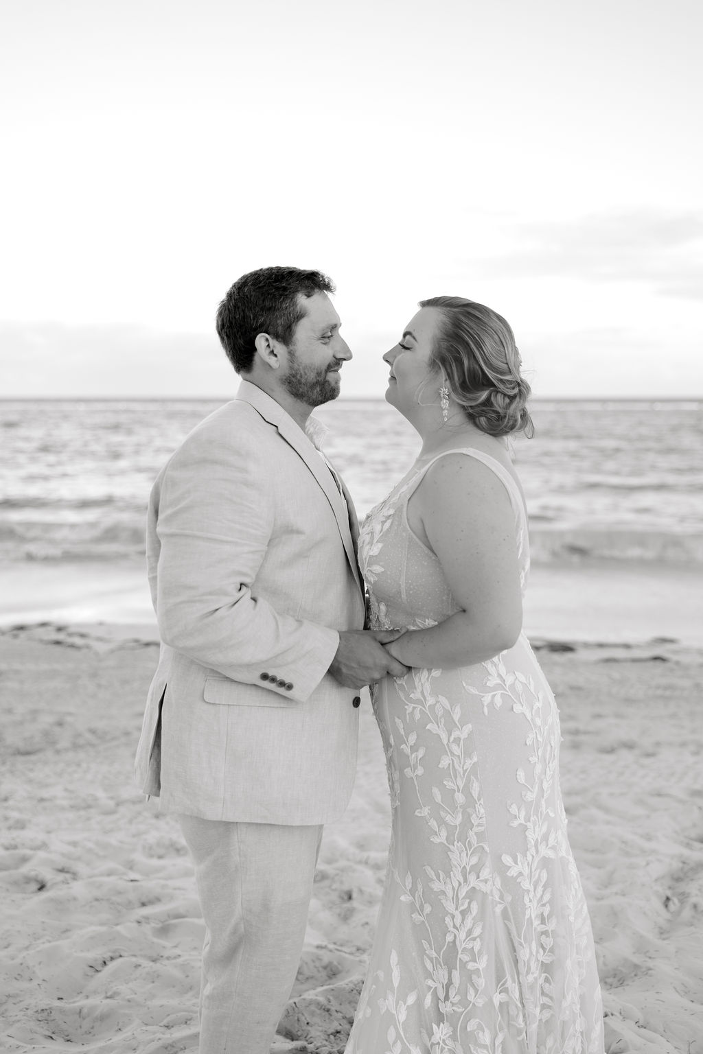 Destination wedding photographer captures bride and groom embracing