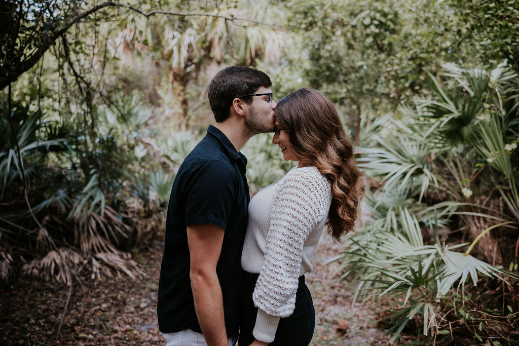 Destination wedding photographer captures man kissing fiance's forehead