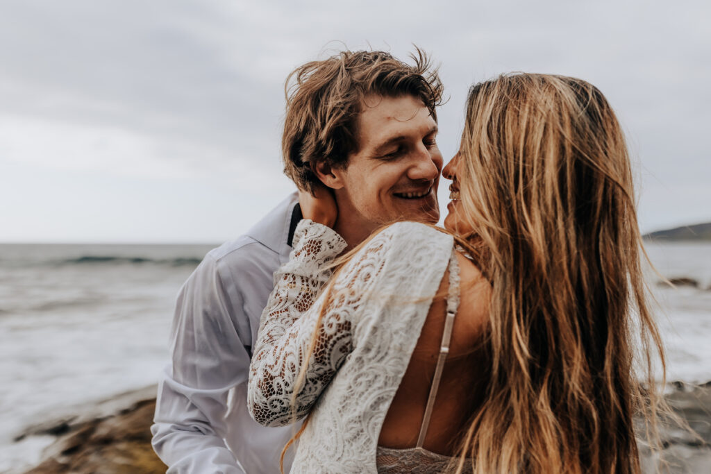 Destination Wedding Photographer captures bride and groom playing together during bridal portraits