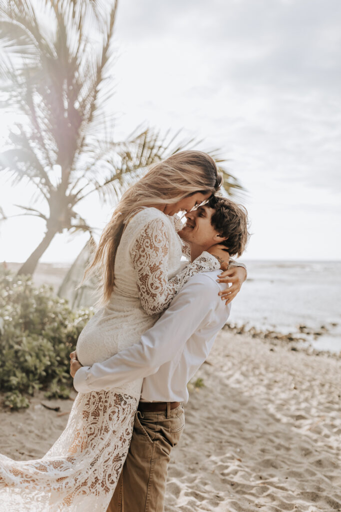 Destination Wedding Photographer captures groom lifting bride in air during bridal portraits