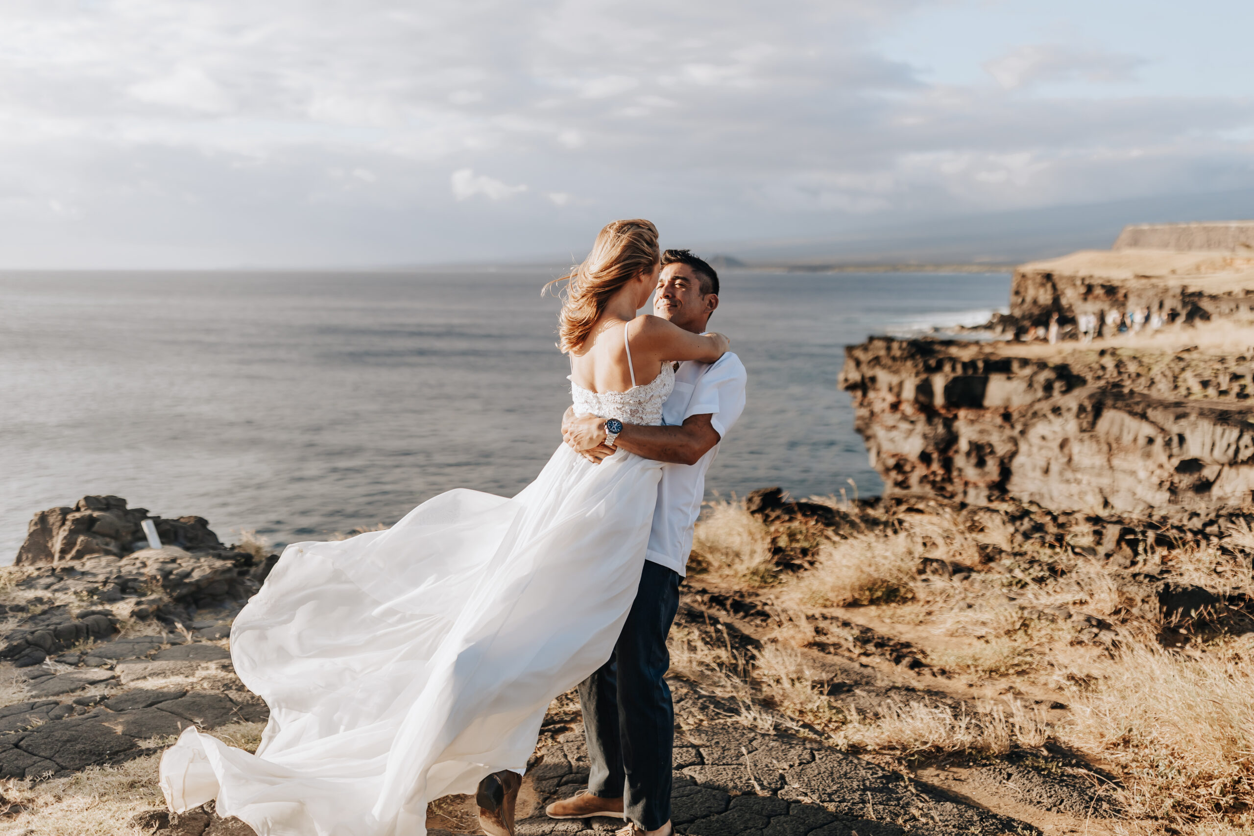 Destination Wedding Photographer captures groom lifting bride and spinning her around