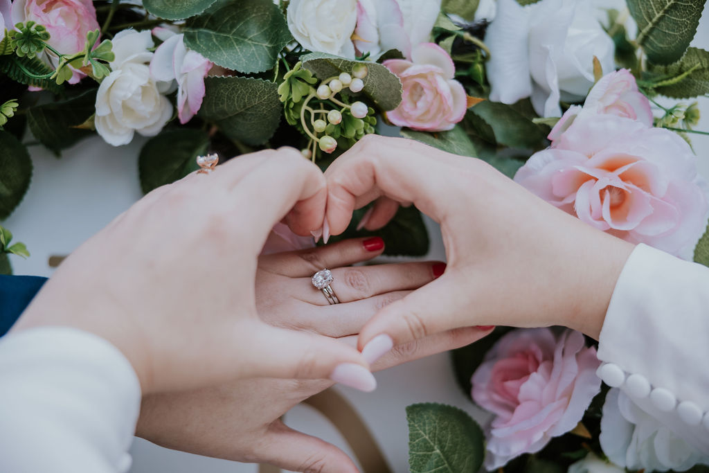 Nashville Elopement Photographer captures woman making heart over engagement ring