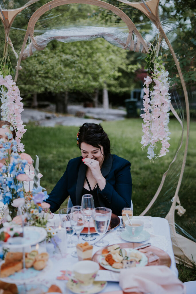 Nashville Elopement Photographer captures woman during tea party covering her face