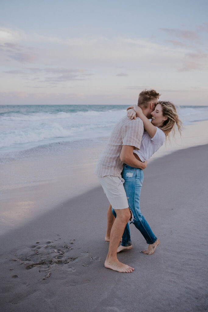 Destination Wedding Photographer captures man hugging woman and tickling her