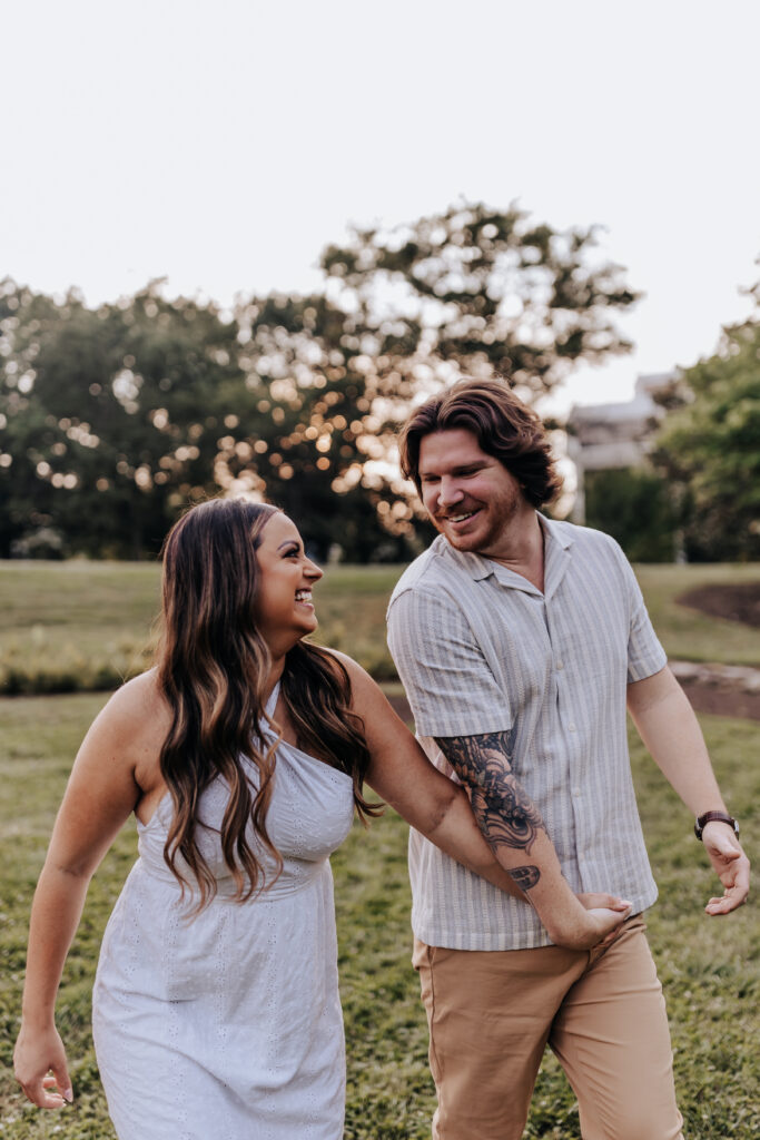 Nashville elopement photographer captures couple holding hands and walking through park