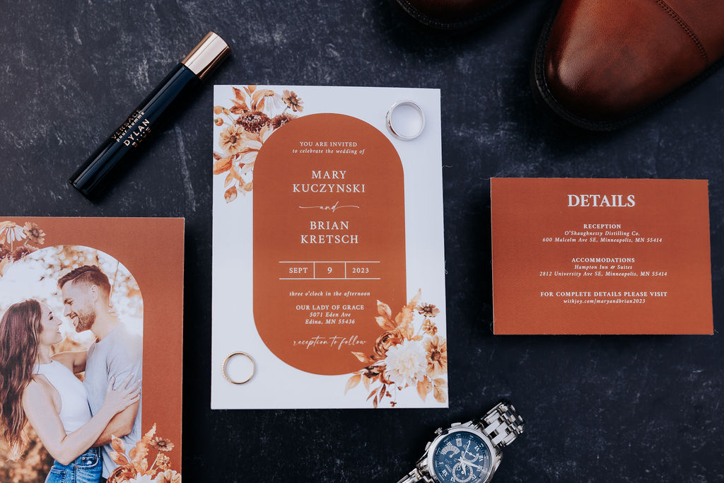 Destination wedding photographer captures wedding invitations and photos before romantic minnesota wedding