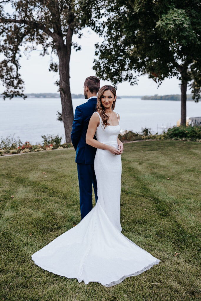 Destination wedding photographer captures bride and groom back to back before first look