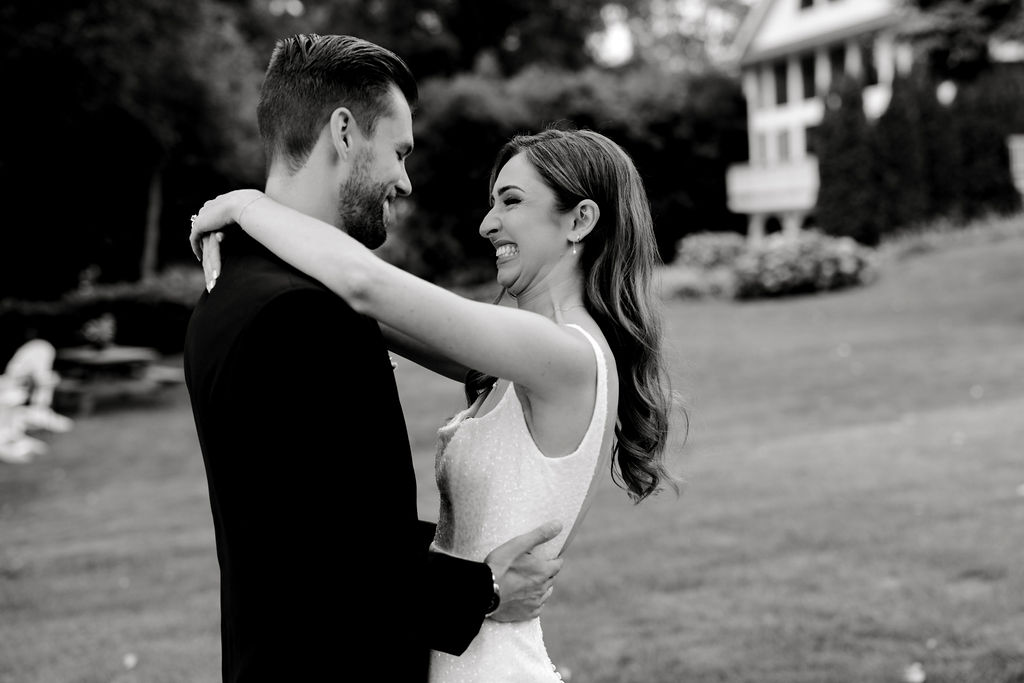 Destination wedding photographer captures bride and groom smiling at one another during first look