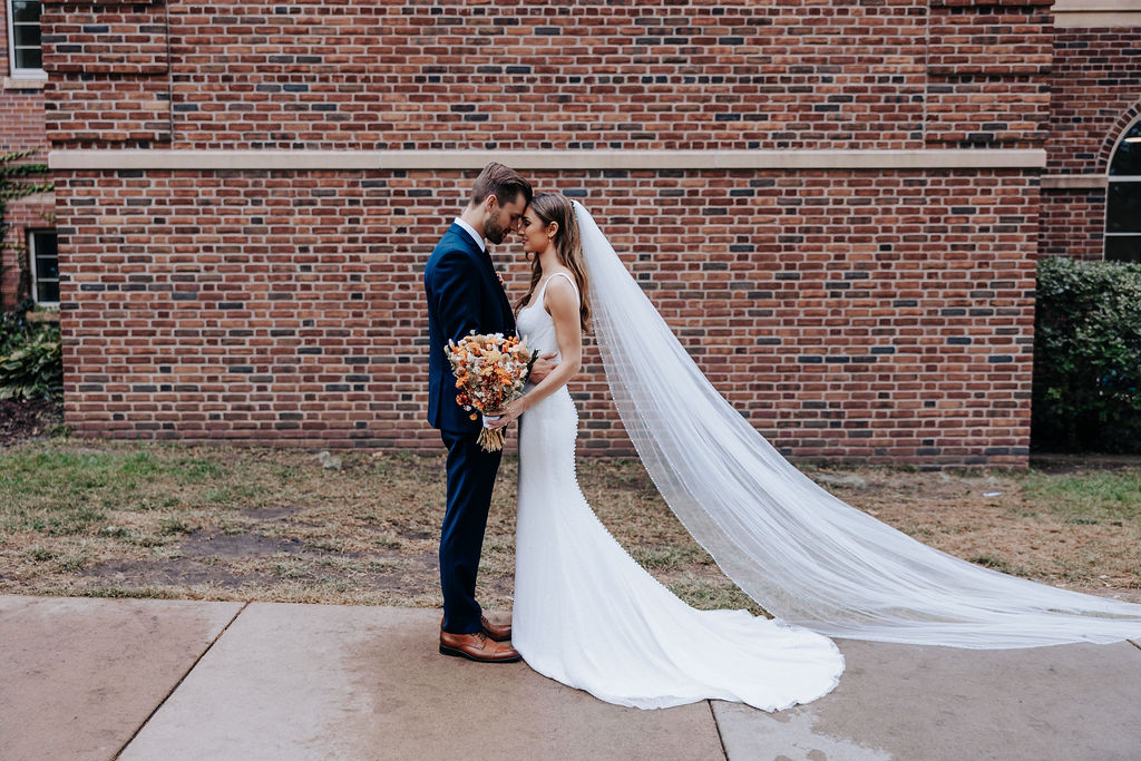 Destination wedding photographer captures bride and groom touching foreheads