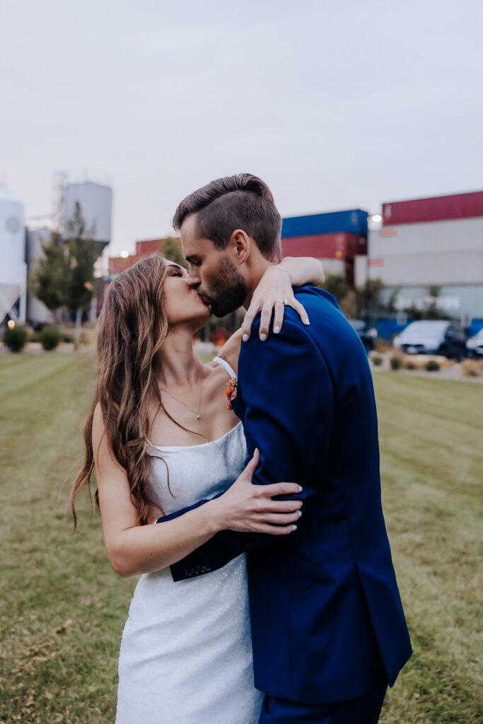 Destination wedding photographer captures bride and groom hugging one another