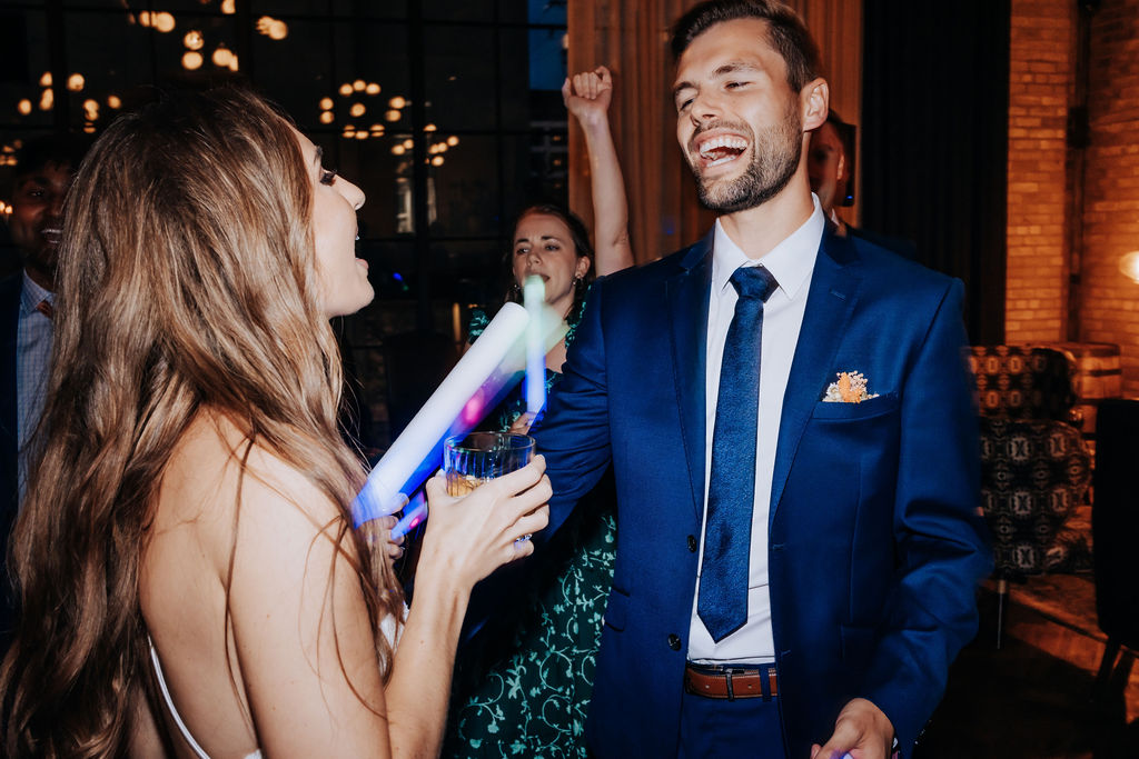 Destination wedding photographer captures groom dancing