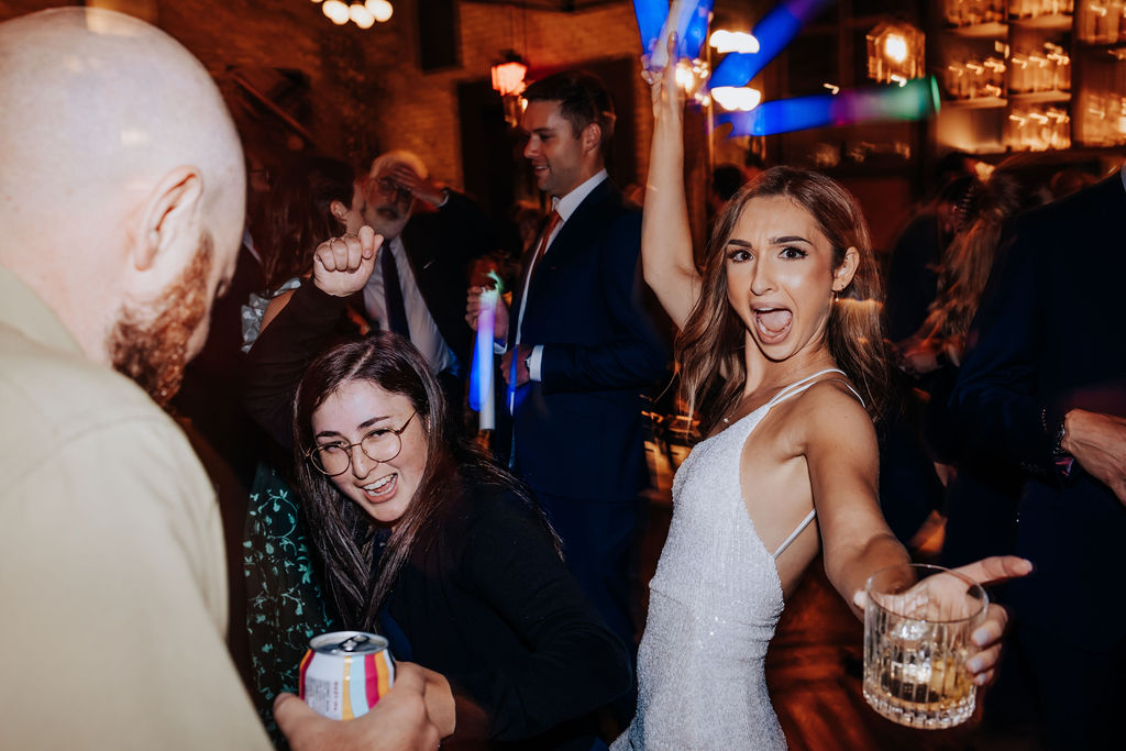 Destination wedding photographer captures bride dancing at reception