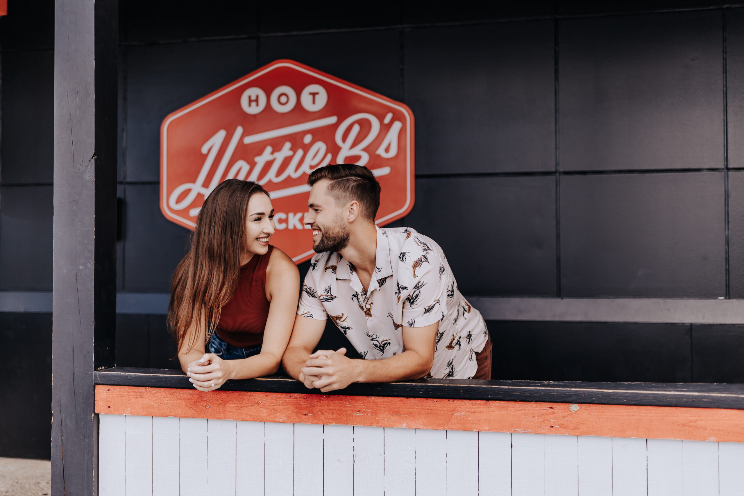 Nashville elopement photographer captures couple at Hattie B's during summer date night ideas in Nashville