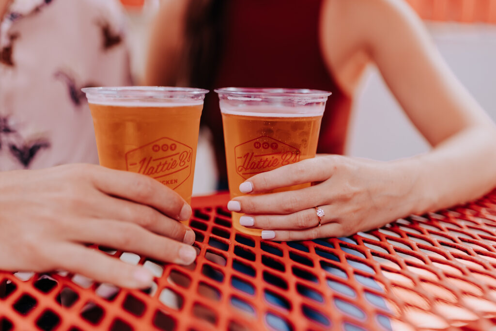 Nashville Elopement Photographer captures couple drinking beers during summer date nights in Nashville