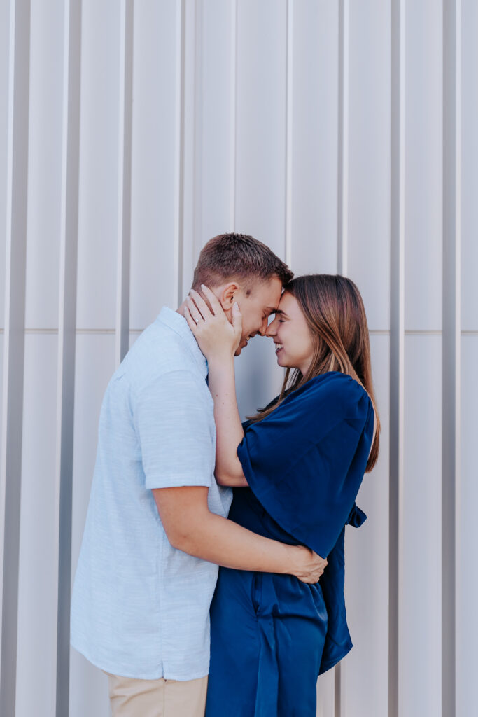 Nashville elopement photographer captures couple touching foreheads during summer date nights in Nashville