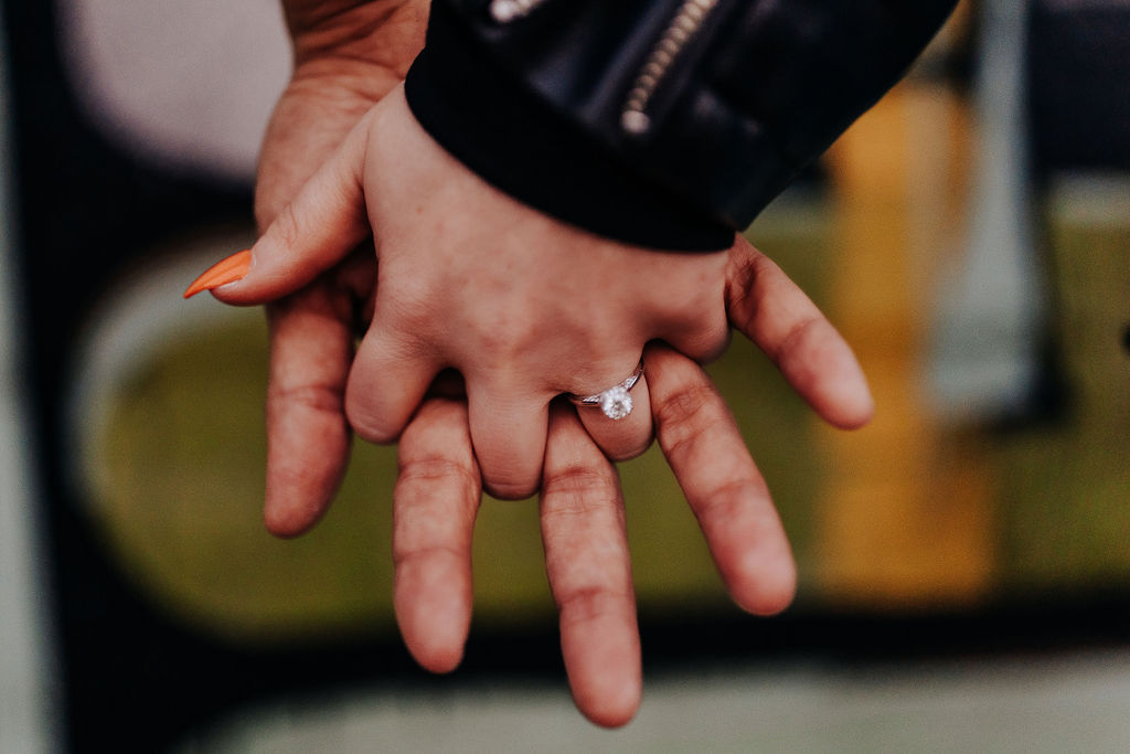 Nashville Elopement Photographer captures bride and groom holding hands showing off engagement ring