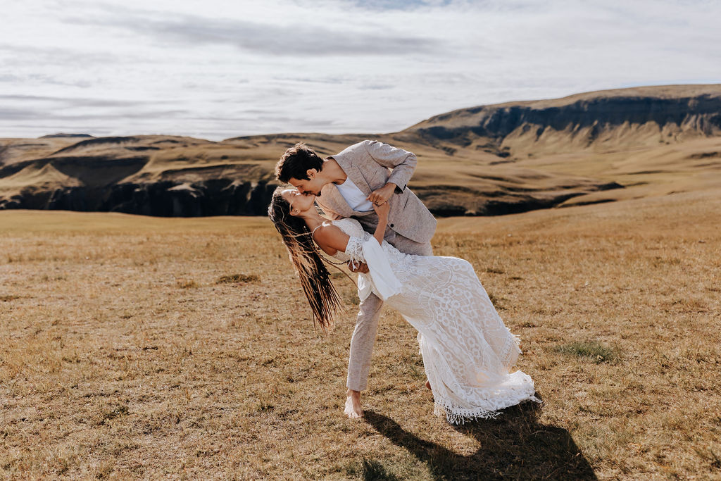 Destination wedding photographer captures bride and groom in dip kiss after Iceland elopement