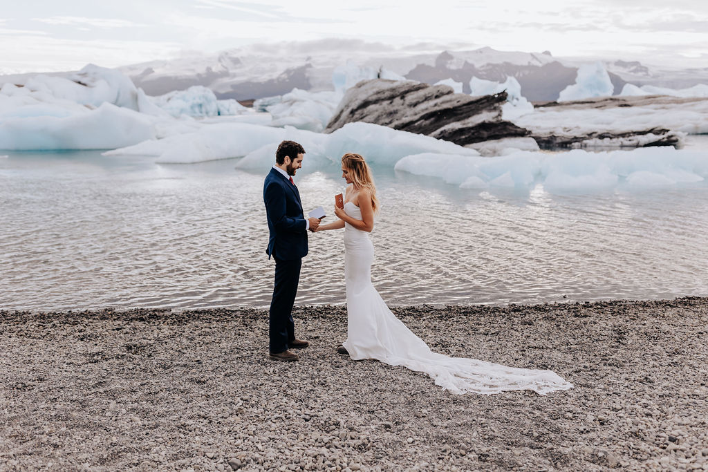 Destination Wedding Photographer captures bride reading vows to groom during intimate ceremony