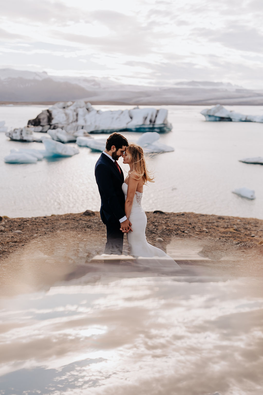 Destination wedding photographer captures man and woman embracing during bridals