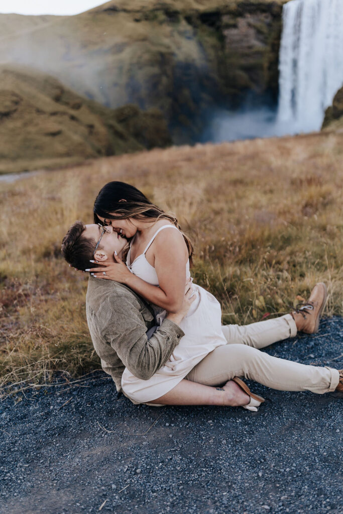 Destination wedding photographer captures woman on man's lap during honeymoon photos