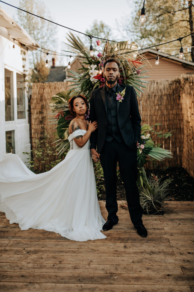 Nashville Elopement Photographer captures bride holding groom's arm during outdoor portraits at small venues in Nashville TN