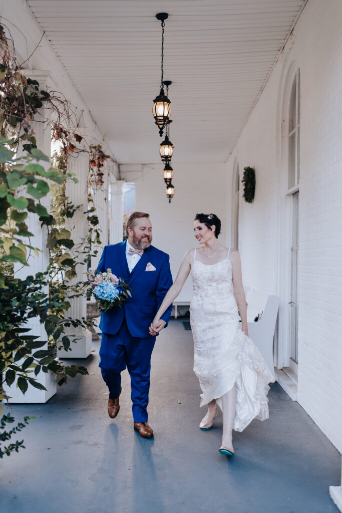 Nashville Elopement Photographer captures bride and groom walking hand in hand while walking 