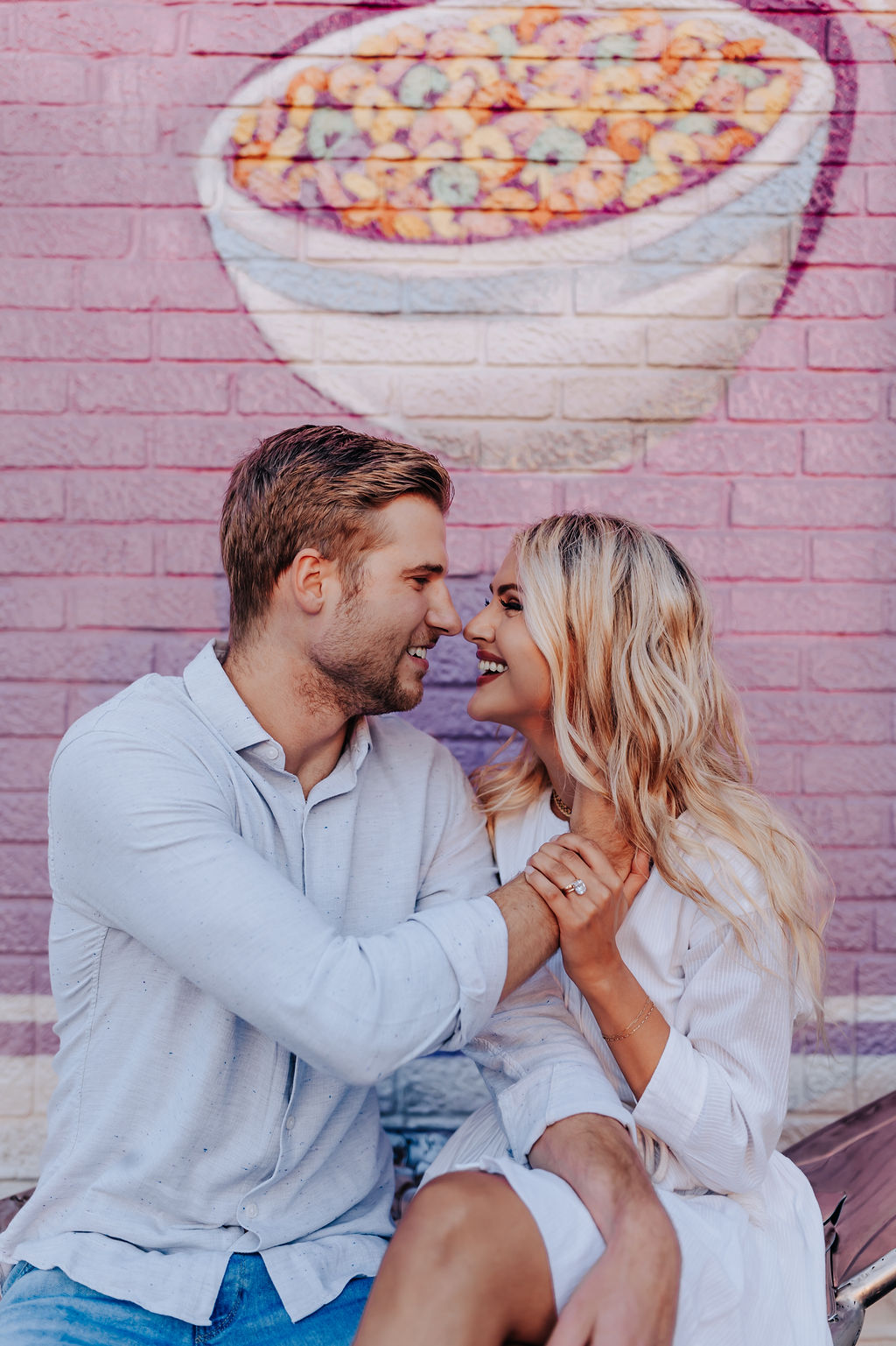 Nashville Engagement Photographer captures husband and wife laughing together during outdoor date night in Nashville