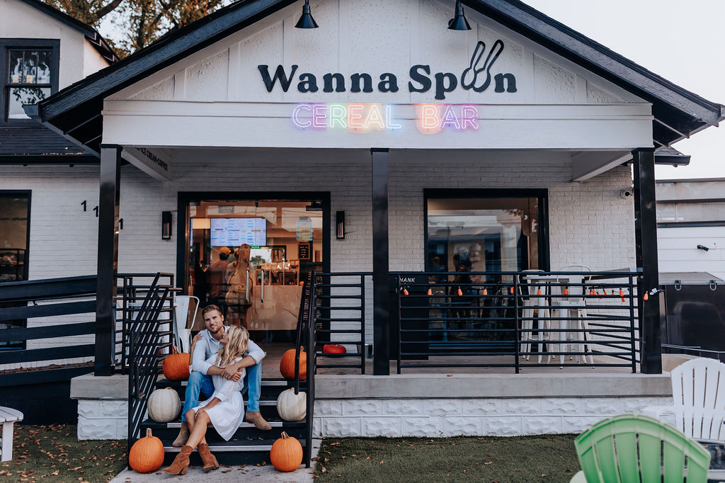 Nashville Engagement Photographer captures couple sitting in front of Wanna Spoon in Nashville 