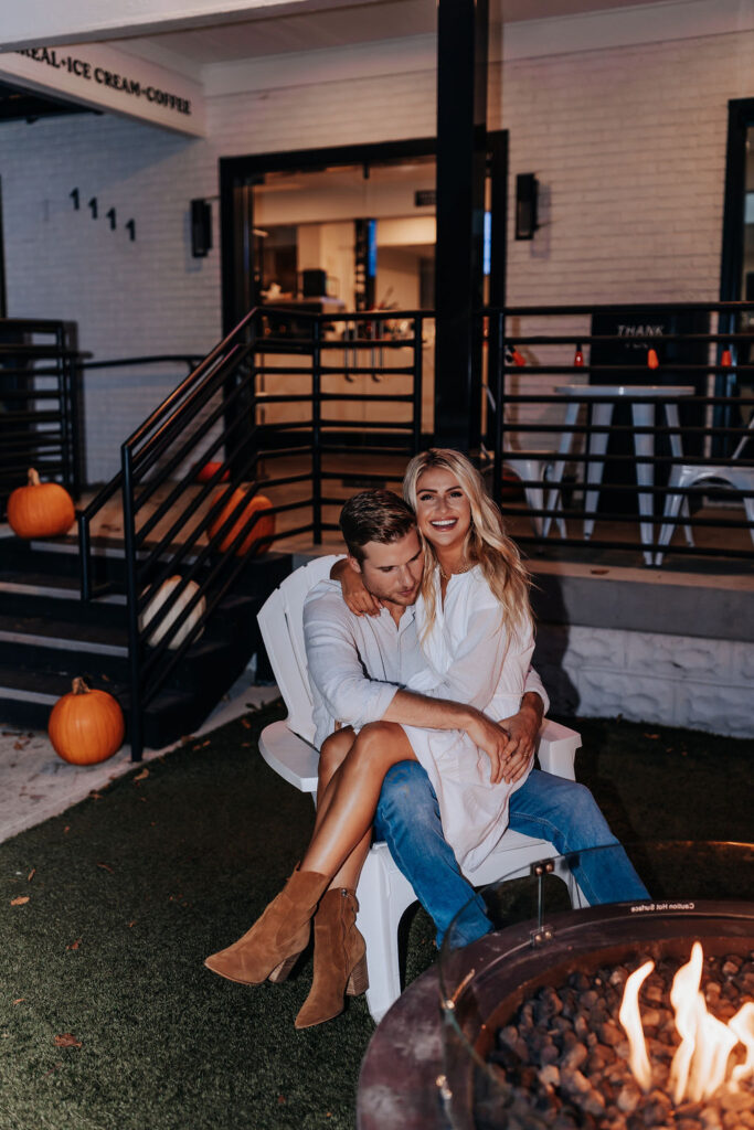 Nashville Engagement Photographer captures man tickling woman while spending time together during date night